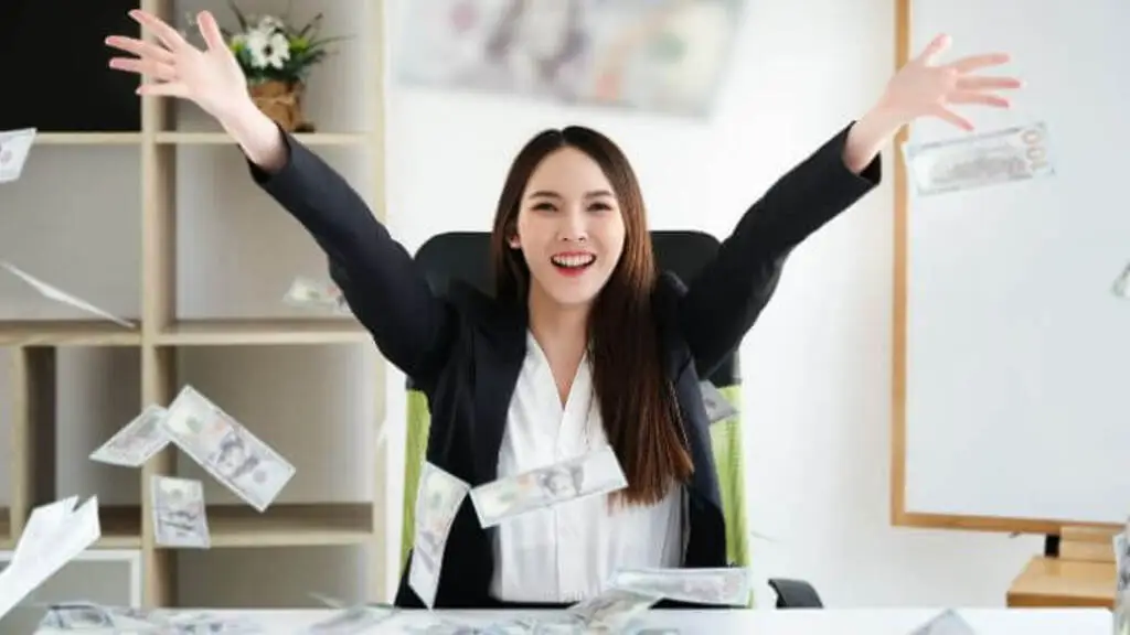 a woman throwing money in the air